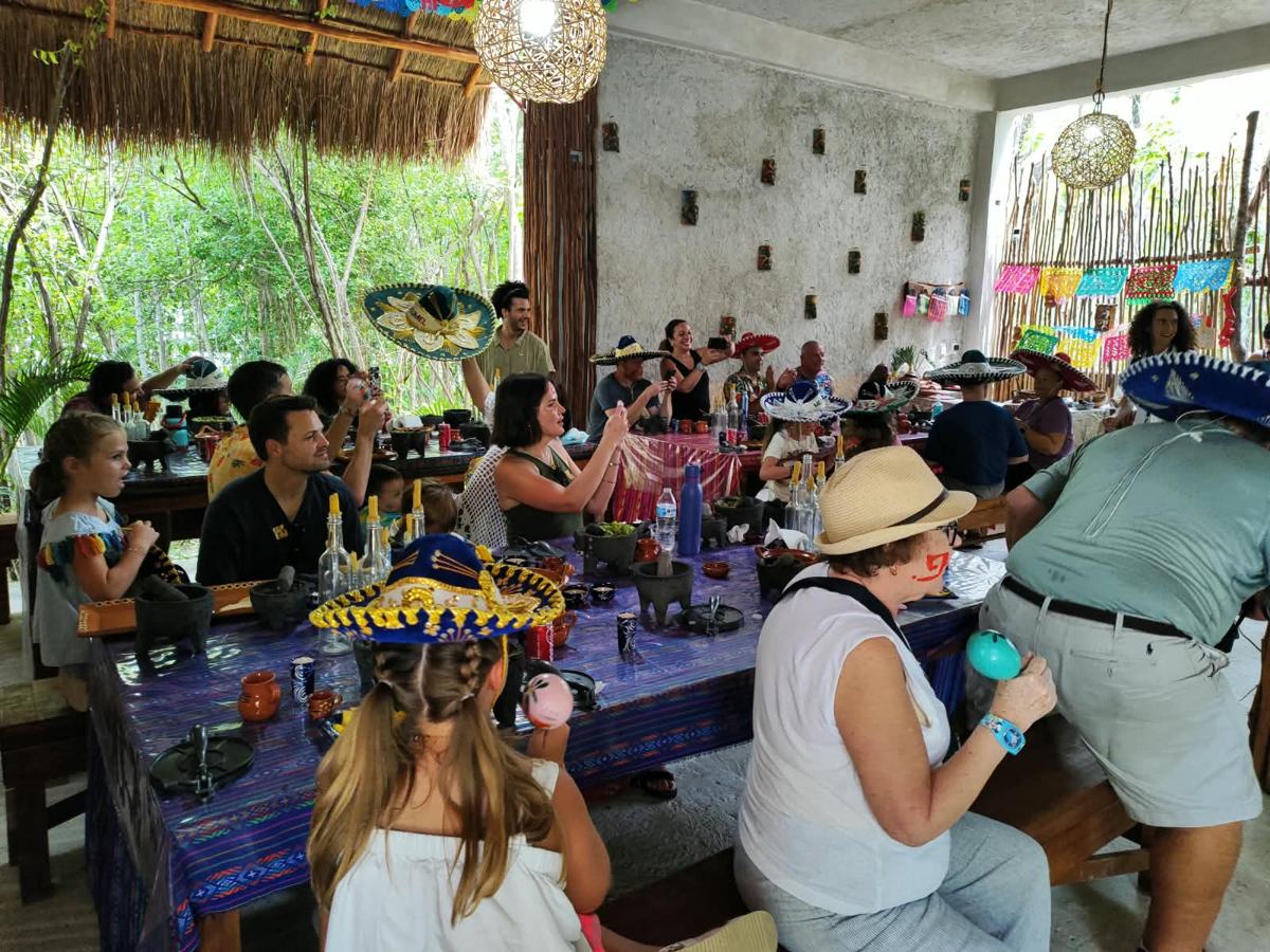 Long tables full of families in sombreros