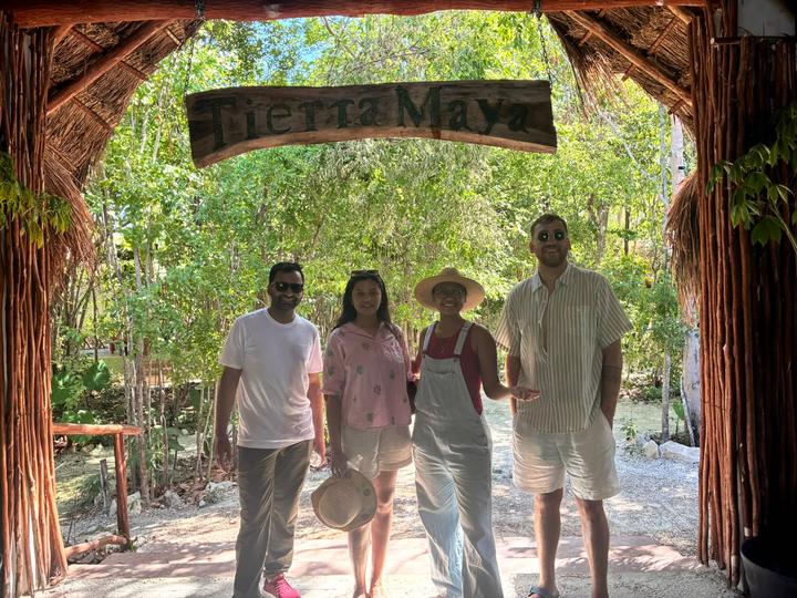 Four guests at the entrance arch