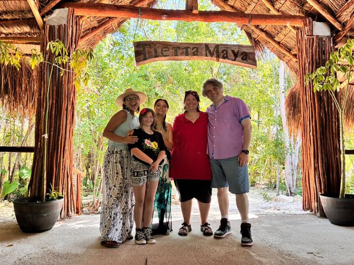 Family of five at the entrance arch