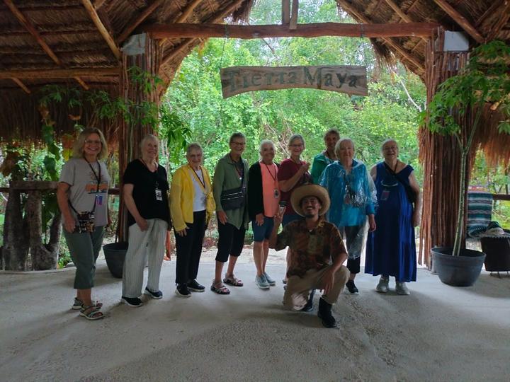 Group of twelve with guide kneeling